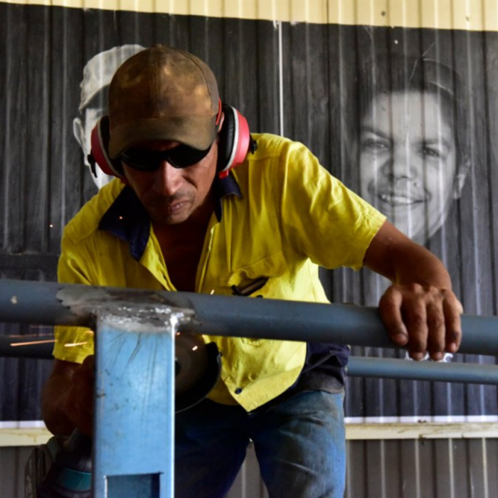 Canva-Worker Metal Work